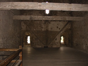 A room in the keep where prisoners of war were kept. The original roofline can be seen on the far wall